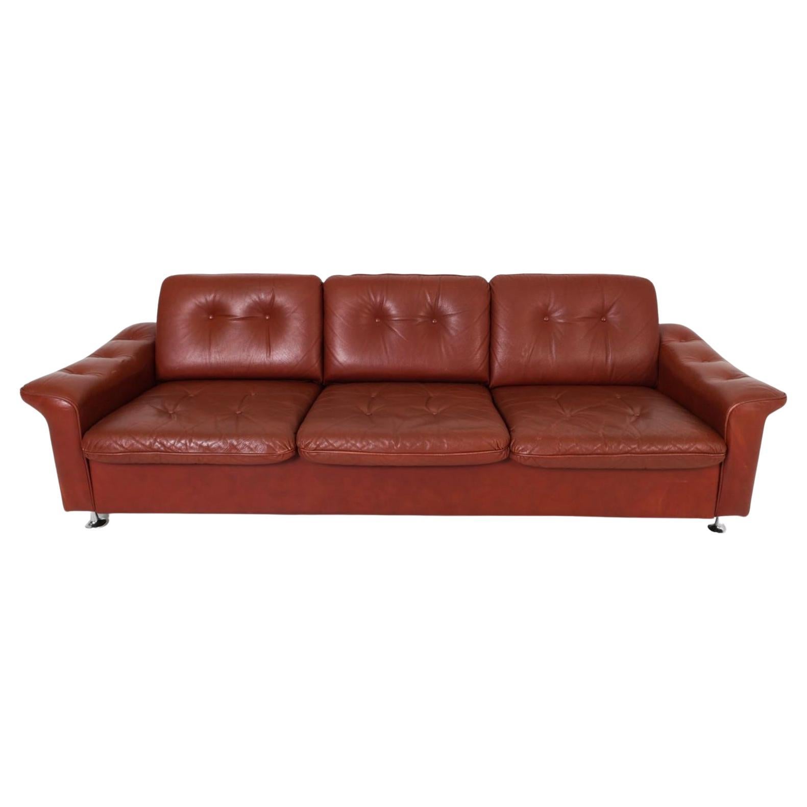 Red leather sofa, chrome legs